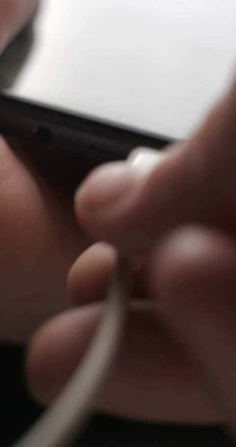 USB-C cable macro plugin to smartphone slow motion, vertical view Video stock 281040893