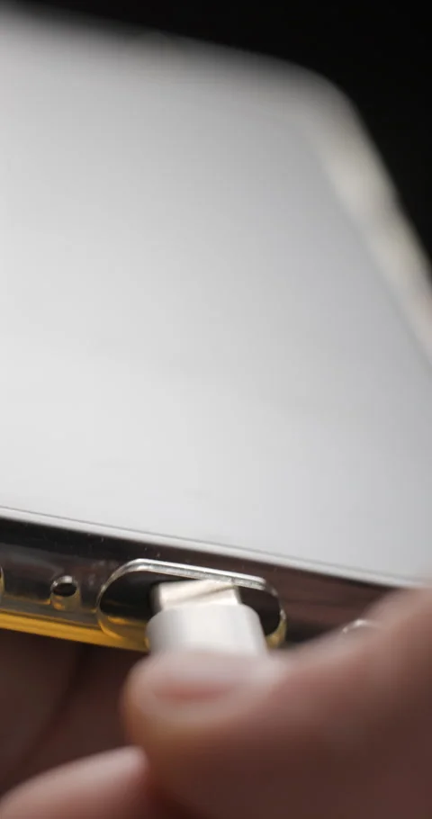 USB-C cable macro plugin to smartphone slow motion, vertical view Video stock 281040964