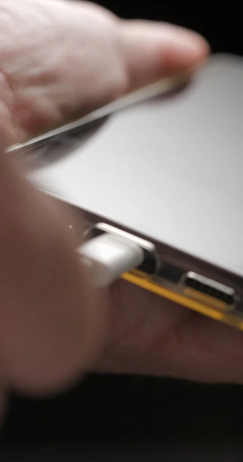 USB-C cable macro plugin to smartphone slow motion, vertical view Video stock 281041051