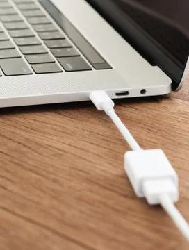 Usb-c cable type connect to laptop computer Stock Photos