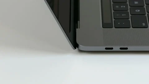 USB-C Thunderbolt ports on the side of an Apple MacBook Pro computer. Video stock 237752158