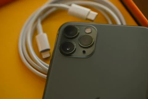 USB-C type to Lightning fast charging cable of with iPhone 11 Pro Max Stock Photos