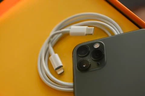 USB-C type to Lightning fast charging cable of with iPhone 11 Pro Max Stock Photos