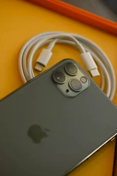 USB-C type to Lightning fast charging cable of with iPhone 11 Pro Max Stock Photos