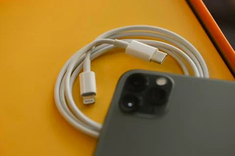 USB-C type to Lightning fast charging cable with iPhone 11 Pro Max Stock Photos