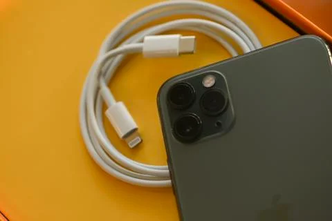 USB-C type to Lightning fast charging cable of with iPhone 11 Pro Max Stock Photos