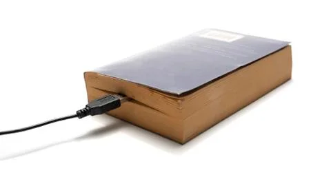 Usb cable and book Stock Photos