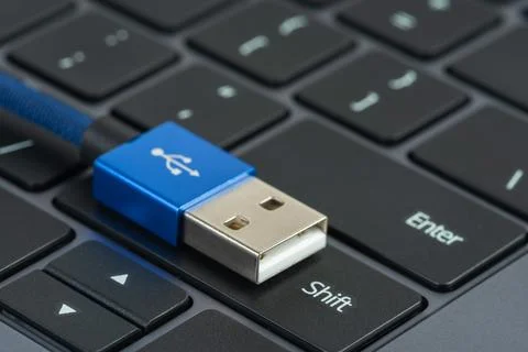Usb cable on button shift of laptop keyboard Stock Photos