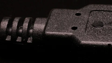 USB cable close up on a black background with slow and smooth camera movement Stock Footage 104054039