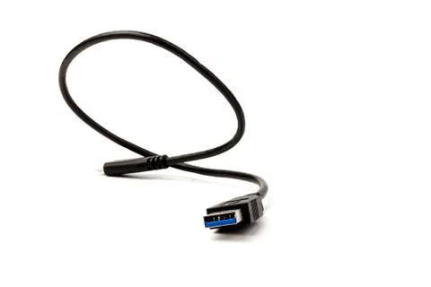 USB cable close up on white background. Charge, plugging, equipment and elect Stock Photos