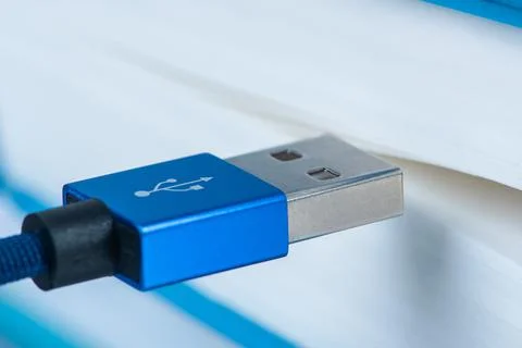 USB cable connected to book Stock Photos