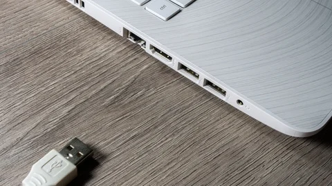 Usb cable connecting to computer. 4k stop motion shot. Stock Footage 124546283