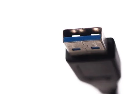 USB cable connector with blurred cable close up Stock Photos
