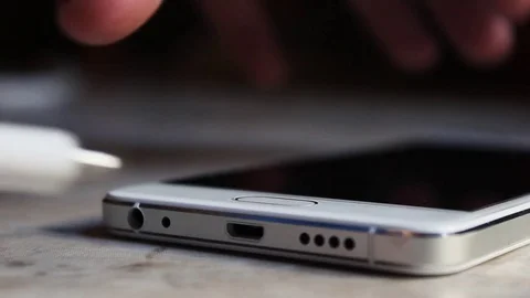 Usb cable connects to a mobile phone Video stock 71199420