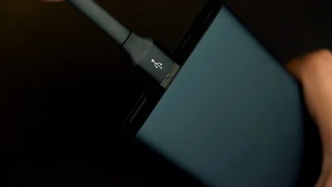 USB cable connects to portable power bank Stock Footage 105969761