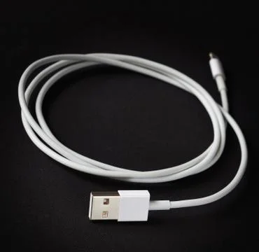 USB cable on dark background, shallow depth of sharpness Stock Photos