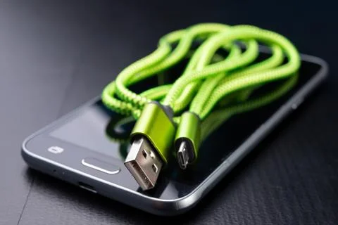 A usb cable for data transfer and phone charging. Telephone and accessories o Stock Photos