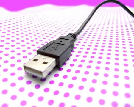 Usb cable on dotted background Stock Photos