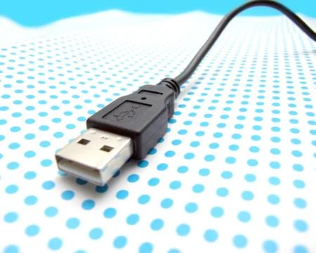 Usb cable on dotted background Stock Photos