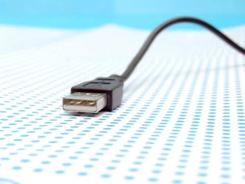 Usb cable on dotted background Stock Photos