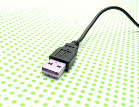 Usb cable on dotted background Stock Photos
