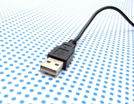 Usb cable on dotted background Stock Photos