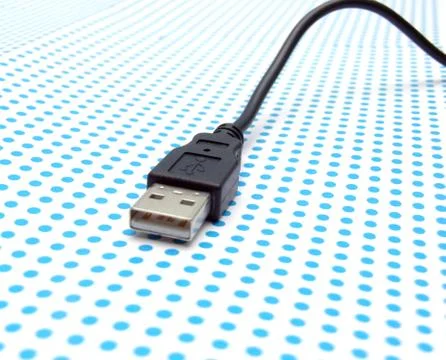 Usb cable on dotted background Stock Photos