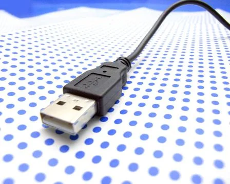 Usb cable on dotted background usb cable on dotted background ,model relea... Stock Photos