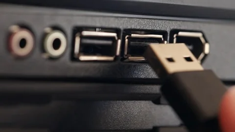 USB cable is inserted into socket. Black panel with colored connectors for micro Stock Footage 126612340