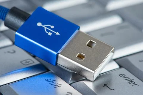Usb cable on laptop keyboard Stock Photos
