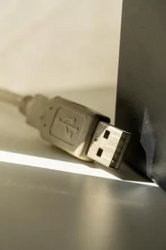 A USB cable laying on a table Stock Photos