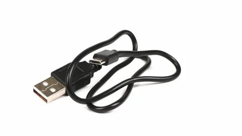 USB Cable for mikrocut. Black USB cable for charging a smartphone Stock Footage 238497112