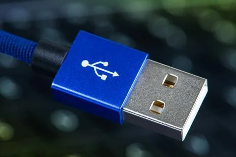 Usb cable plug on blurred bokeh background Stock Photos