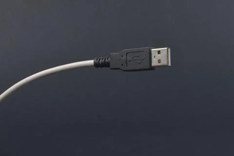 USB Cable Plug  on dark background Stock Photos