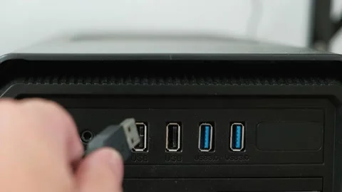 USB cable plugged into desktop computer data connecting port. Stock Footage 160309454