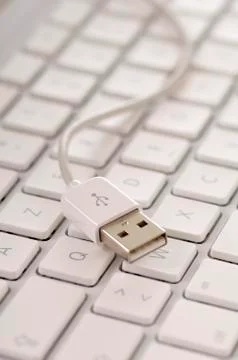 USB Cable Resting on Keyboard Stock Photos