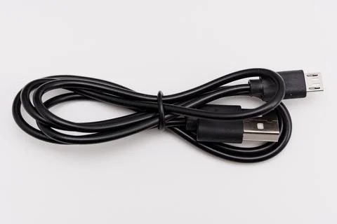 USB cable used for connecting devices and charging electronic items Stock Photos