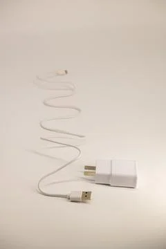 USB cable on a white background. A white prod for the phone Stock Photos