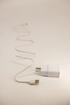 USB cable on a white background. A white prod for the phone Stock Photos