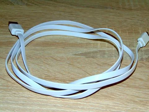 USB cable on a wooden background Stock Photos