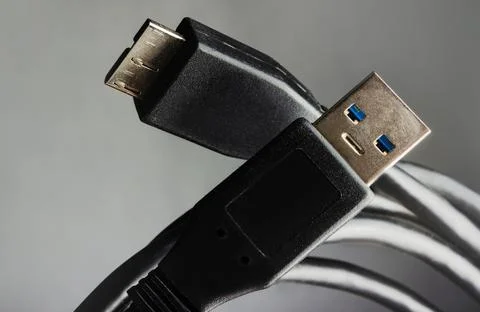Usb cables on grey background. Stock Photos