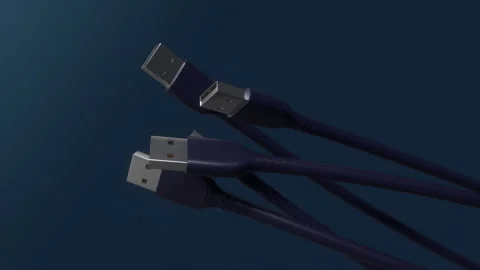 USB cables spinning on blue background.Close-up view plug.USB connectors.Loop Stock Footage 250351594