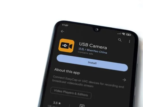 USB Camera app play store page on smartphone on white background Stock Photos