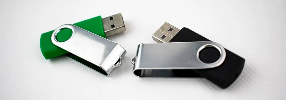 USB devices for data storage made of plastic and metal, open, on white backgr Stock Photos