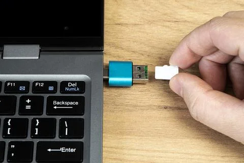 Usb flash drive adapter micro sd card connection to laptop. micro sd card in  Stock Photos