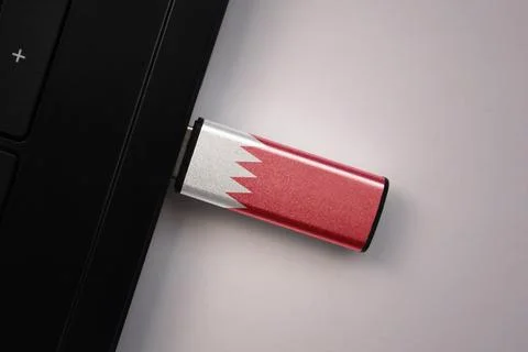 Usb flash drive in notebook computer with the national flag of bahrain on g.. Stock Photos