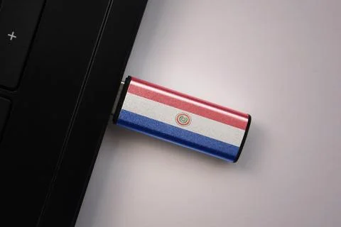 Usb flash drive in notebook computer with the national flag of paraguay on .. Stock Photos