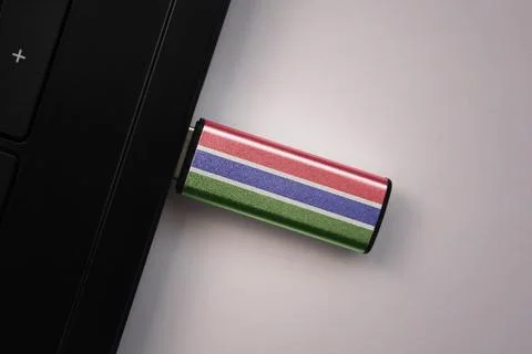 Usb flash drive in notebook computer with the national flag of gambia on gr.. 写真素材