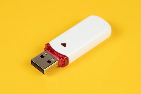 USB flash drive on yellow background Stock Photos