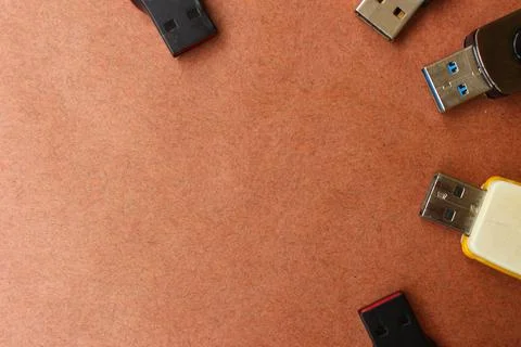 Usb flash drives against brown background Stock Photos